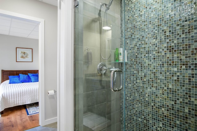 ensuite bathroom featuring a shower stall and ensuite bath
