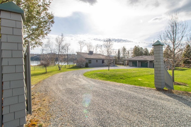 exterior space featuring driveway and a front yard