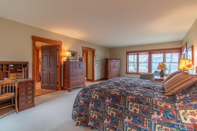 bedroom with light colored carpet
