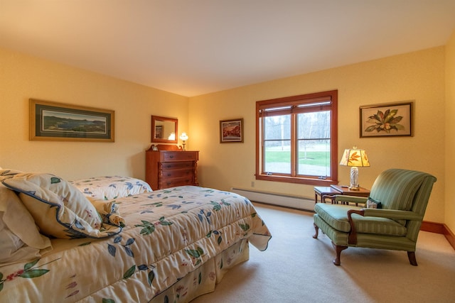 bedroom featuring baseboard heating and carpet