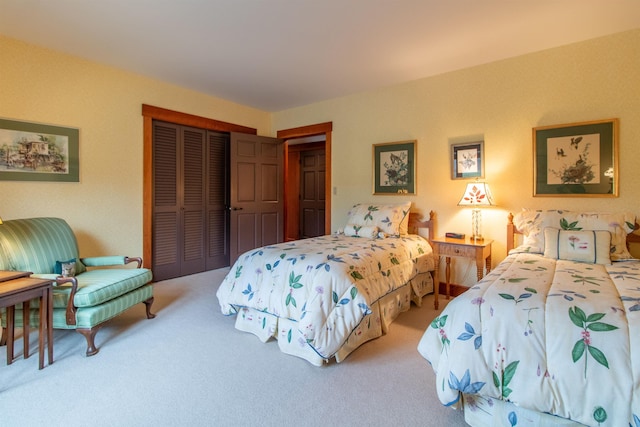 bedroom with carpet and a closet