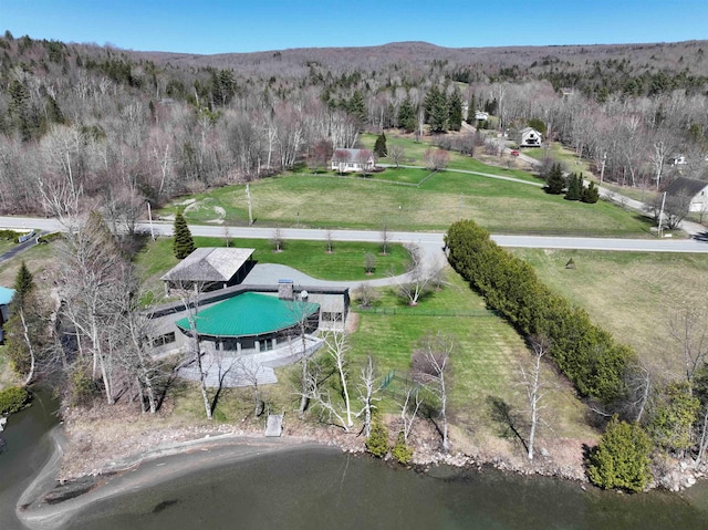 aerial view featuring a forest view and a rural view