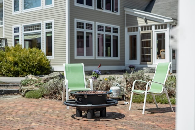 exterior space with a patio and an outdoor fire pit