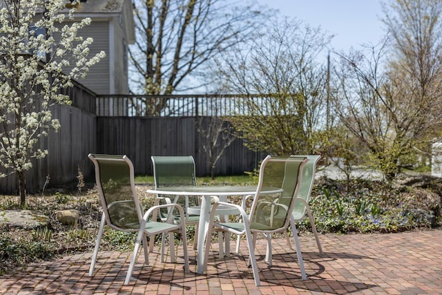 view of patio / terrace featuring fence