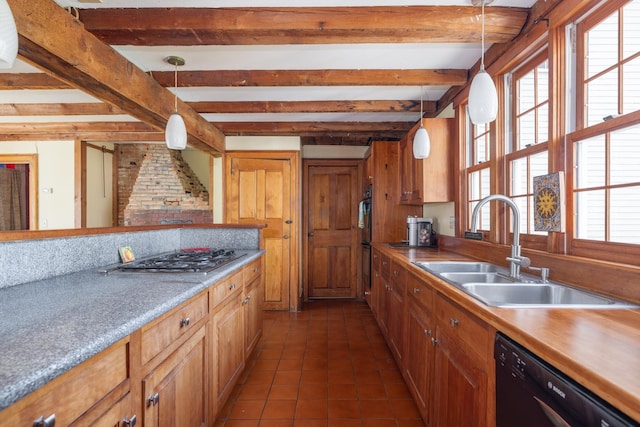 kitchen with a sink, beam ceiling, black appliances, and a healthy amount of sunlight