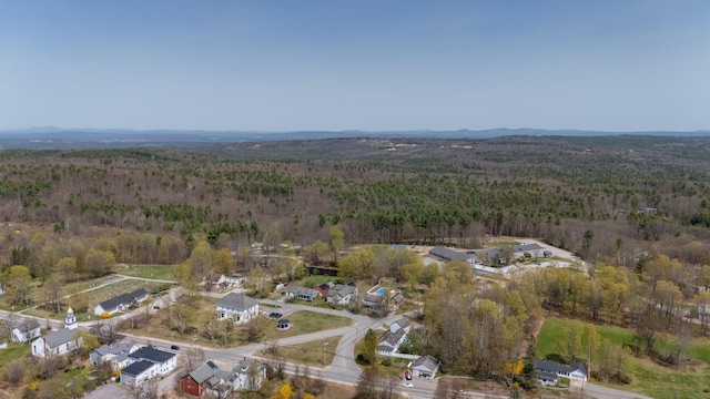 birds eye view of property featuring a wooded view