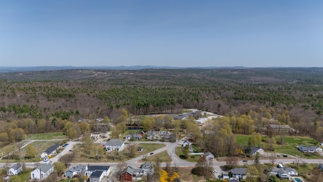 drone / aerial view with a view of trees