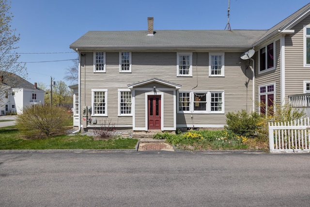 view of front of house featuring fence
