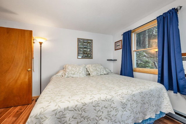 bedroom featuring wood finished floors