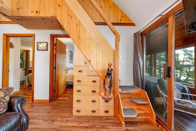 staircase with wood finished floors
