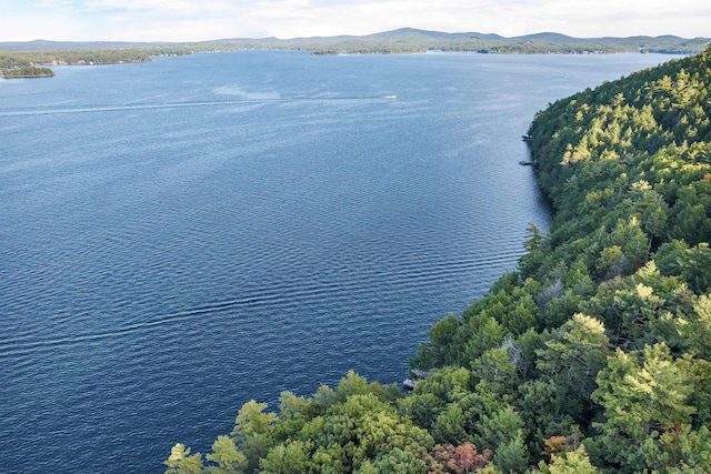 aerial view featuring a water and mountain view