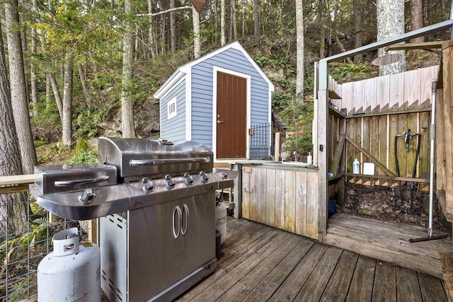 wooden deck with a grill
