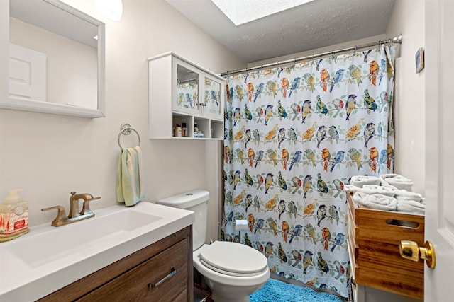 full bathroom with toilet, a skylight, curtained shower, and vanity