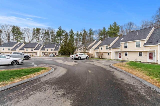 view of road featuring curbs and a residential view