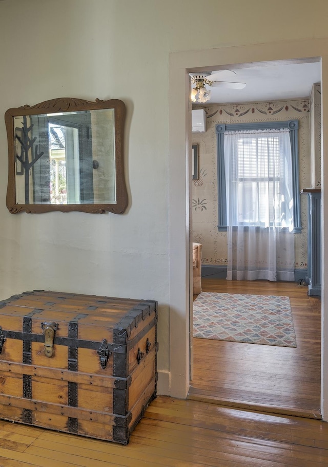 bedroom featuring wood-type flooring and wallpapered walls
