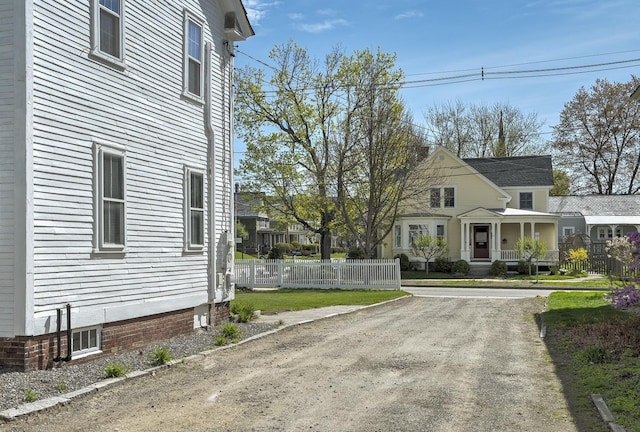 view of property exterior with fence