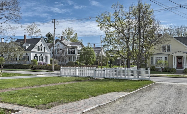 view of road with a residential view and sidewalks