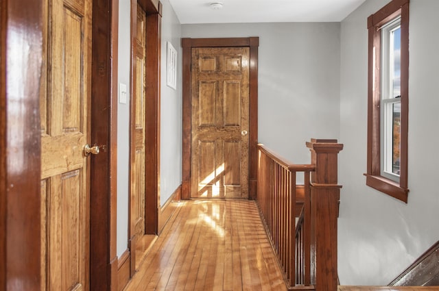 19 Orchard St, Newport City, VT 05855 - hall with a healthy amount of sunlight, baseboards, light wood finished floors, and an upstairs landing