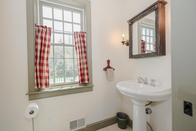 31 Shetland Rd, Chester, NH 03036 - bathroom featuring visible vents, baseboards, tile patterned flooring, and a wealth of natural light