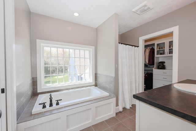 31 Shetland Rd, Chester, NH 03036 - bathroom featuring a garden tub, visible vents, curtained shower, vanity, and tile patterned floors