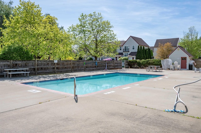 pool featuring a patio and fence