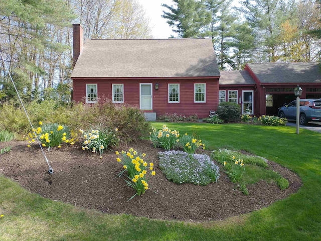 view of front of property with a shingled roof, a chimney, and a front lawn