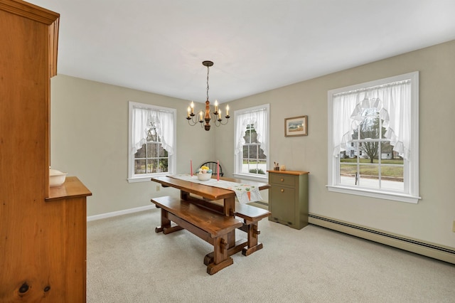 dining room featuring light colored carpet, baseboards, a notable chandelier, and baseboard heating