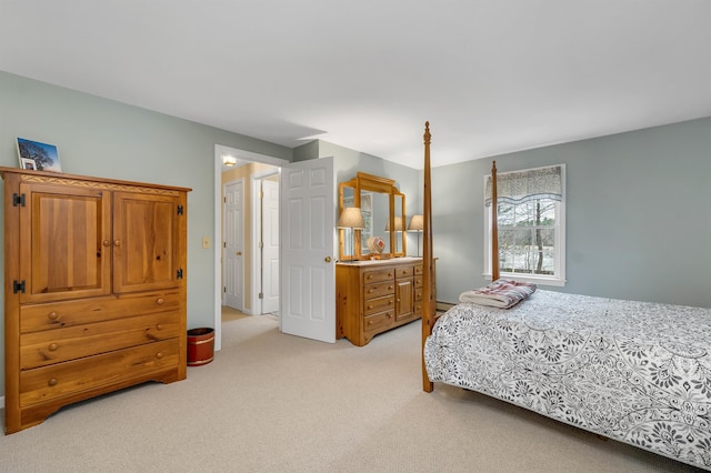 bedroom featuring light colored carpet