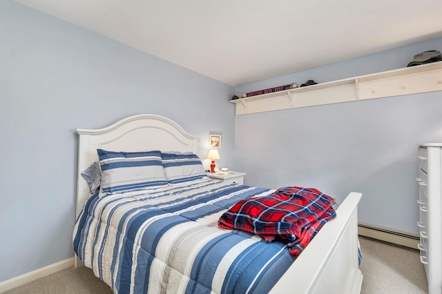 carpeted bedroom with baseboards and a baseboard heating unit