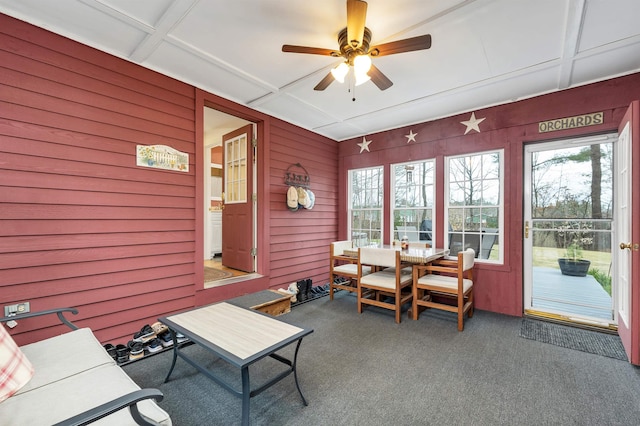 sunroom / solarium featuring a ceiling fan and a wealth of natural light