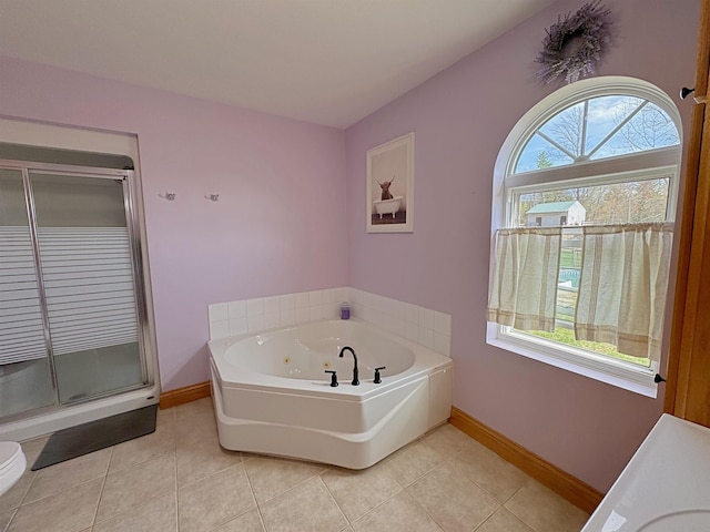 full bath with baseboards, a stall shower, a whirlpool tub, and tile patterned flooring