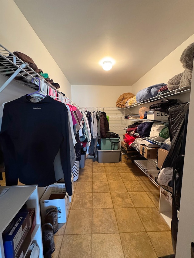 spacious closet featuring tile patterned flooring