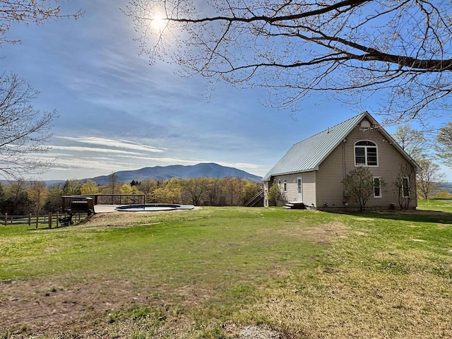 view of yard with fence and a mountain view