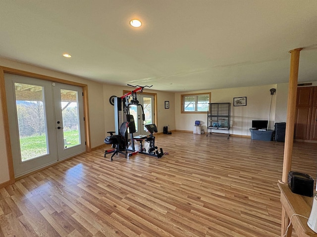 workout room with recessed lighting, baseboards, french doors, and light wood-style floors