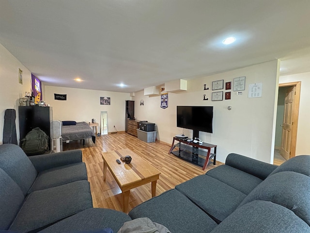 living room with recessed lighting and wood finished floors