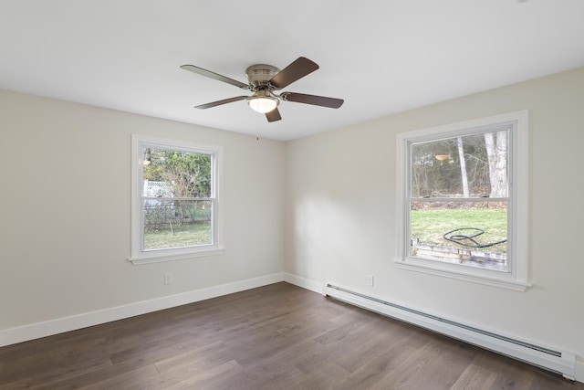 empty room with baseboards, ceiling fan, a baseboard heating unit, and dark wood-style floors