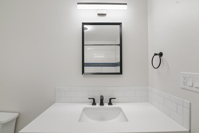 full bath featuring vanity and toilet