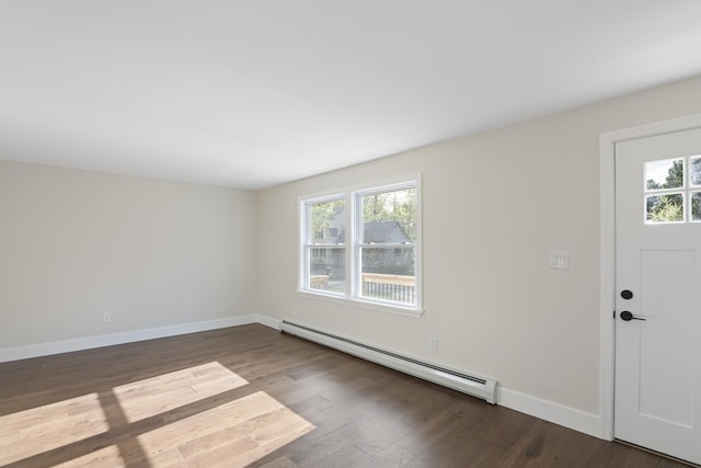foyer with dark wood finished floors, plenty of natural light, and baseboard heating
