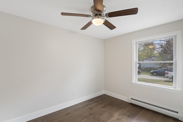 unfurnished room with baseboards, dark wood-style flooring, ceiling fan, and baseboard heating