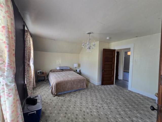 carpeted bedroom featuring baseboards, vaulted ceiling, and an inviting chandelier