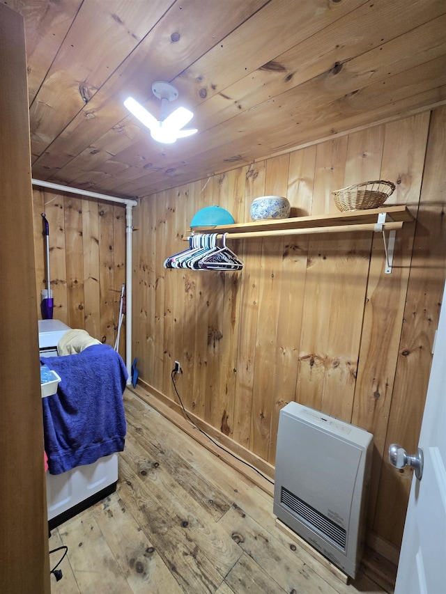 walk in closet with wood-type flooring and heating unit