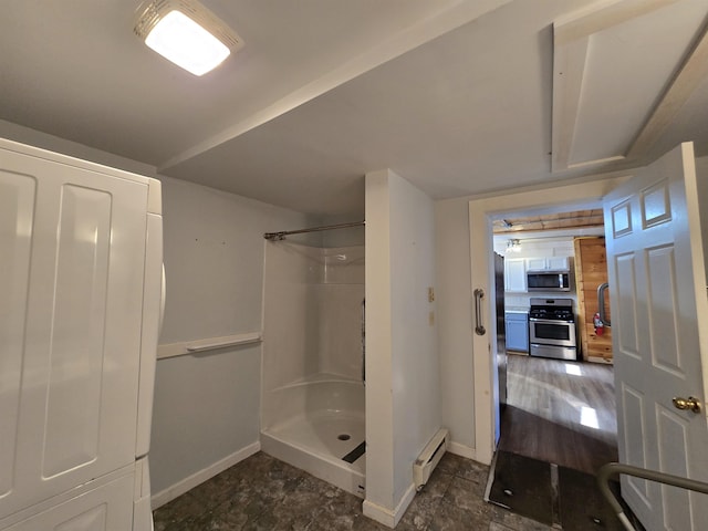 full bath featuring baseboards, baseboard heating, and a shower stall