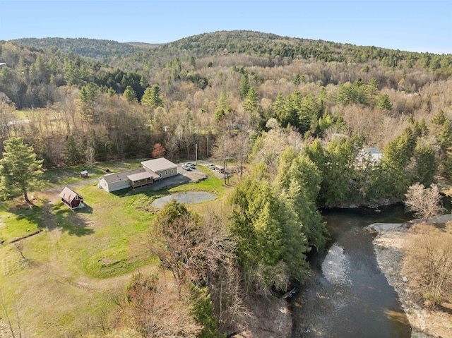 aerial view featuring a mountain view and a wooded view