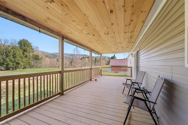 wooden terrace featuring a mountain view