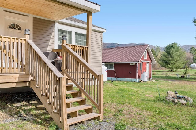 view of exterior entry featuring a yard
