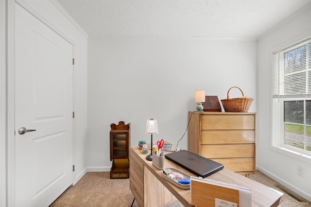 office area featuring light colored carpet, baseboards, crown molding, and visible vents