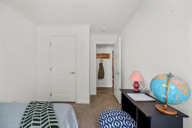 carpeted bedroom featuring crown molding