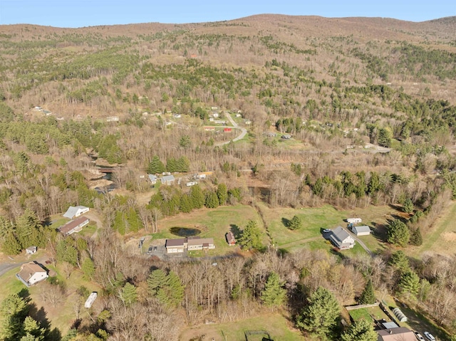 bird's eye view featuring a wooded view