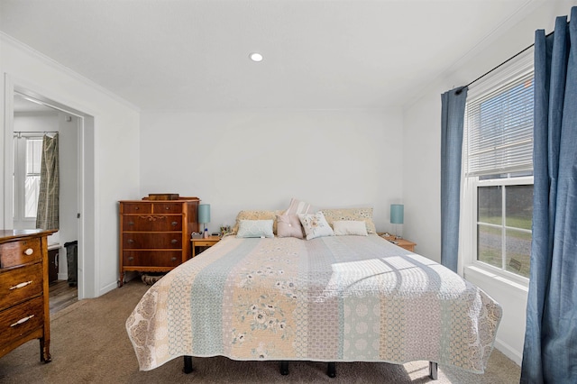 carpeted bedroom with crown molding, baseboards, and recessed lighting