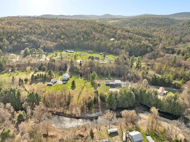 bird's eye view featuring a view of trees and a mountain view